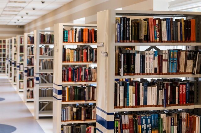 a picture of books on shelves in a library